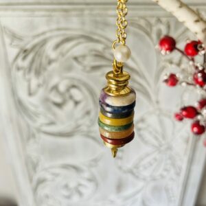 Pendule disque en pierres naturelles 7 chakras - Boutique ésotérique La Porte des Secrets