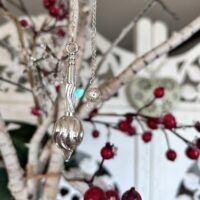 Pendule laiton argenté forme atypique 6cmx1.50cm, poids environ 30 gr boutique ésotérique La Porte des Secrets