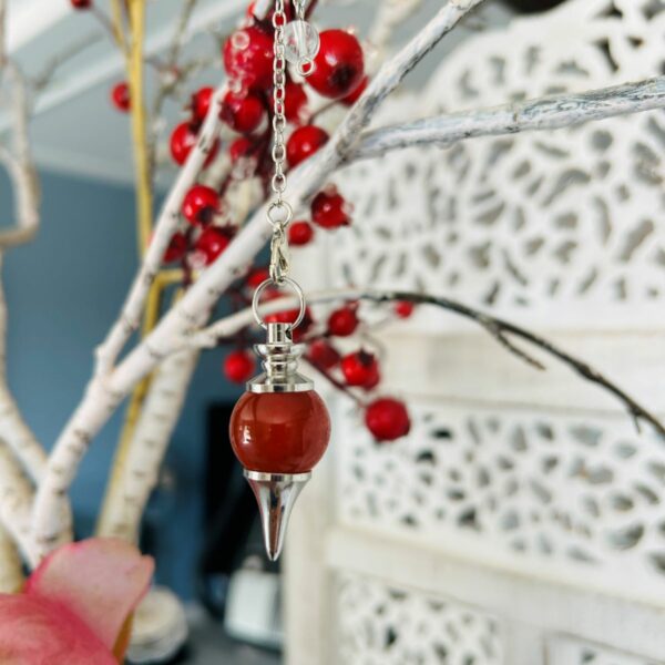 Pendule Téra en Cornaline de forme boule (séphoron) - Boutique ésotérique La Porte des Secrets
