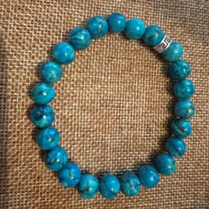 Bracelet Turquoise bleue d'Afrique perles 10mm et 8 mm intercalaire avec perle cache nœud en acier inoxydable motifs celte. Boutique La Porte des Secrets