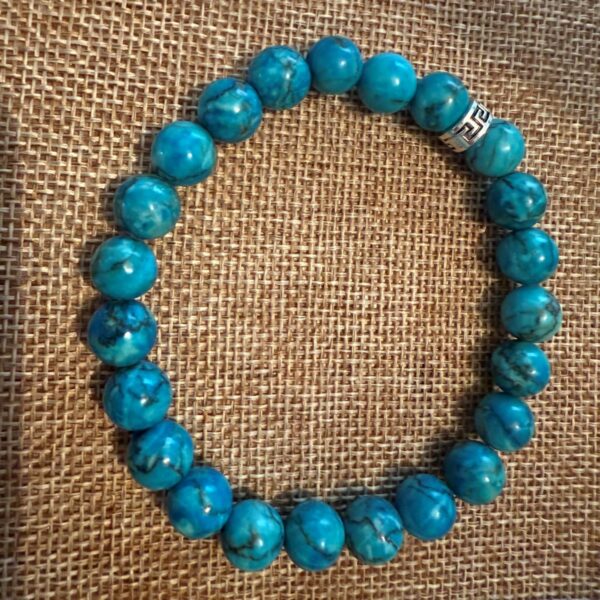 Bracelet Turquoise bleue d'Afrique perles 10mm et 8 mm intercalaire avec perle cache nœud en acier inoxydable motifs celte. Boutique La Porte des Secrets