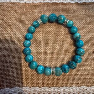 Bracelet Turquoise bleue d'Afrique perles 10mm et 8 mm intercalaire avec 3 perles acier inoxydable motifs celte. Boutique La Porte des Secrets